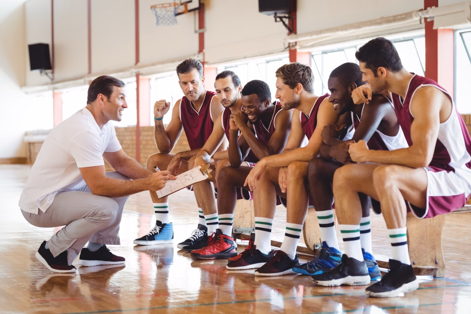 What are the responsibilities of a basketball coach?