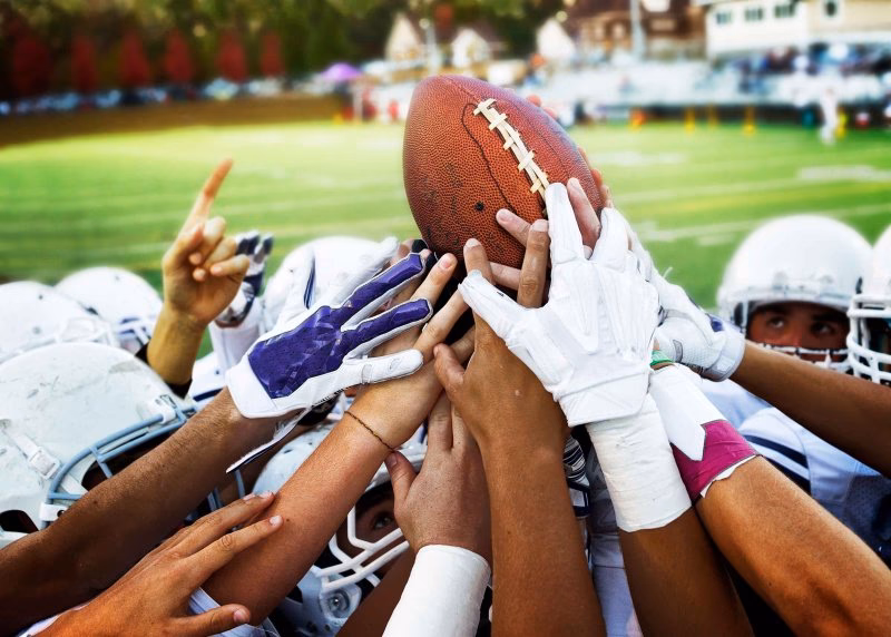 How can I become a football coach if I'm volunteering?