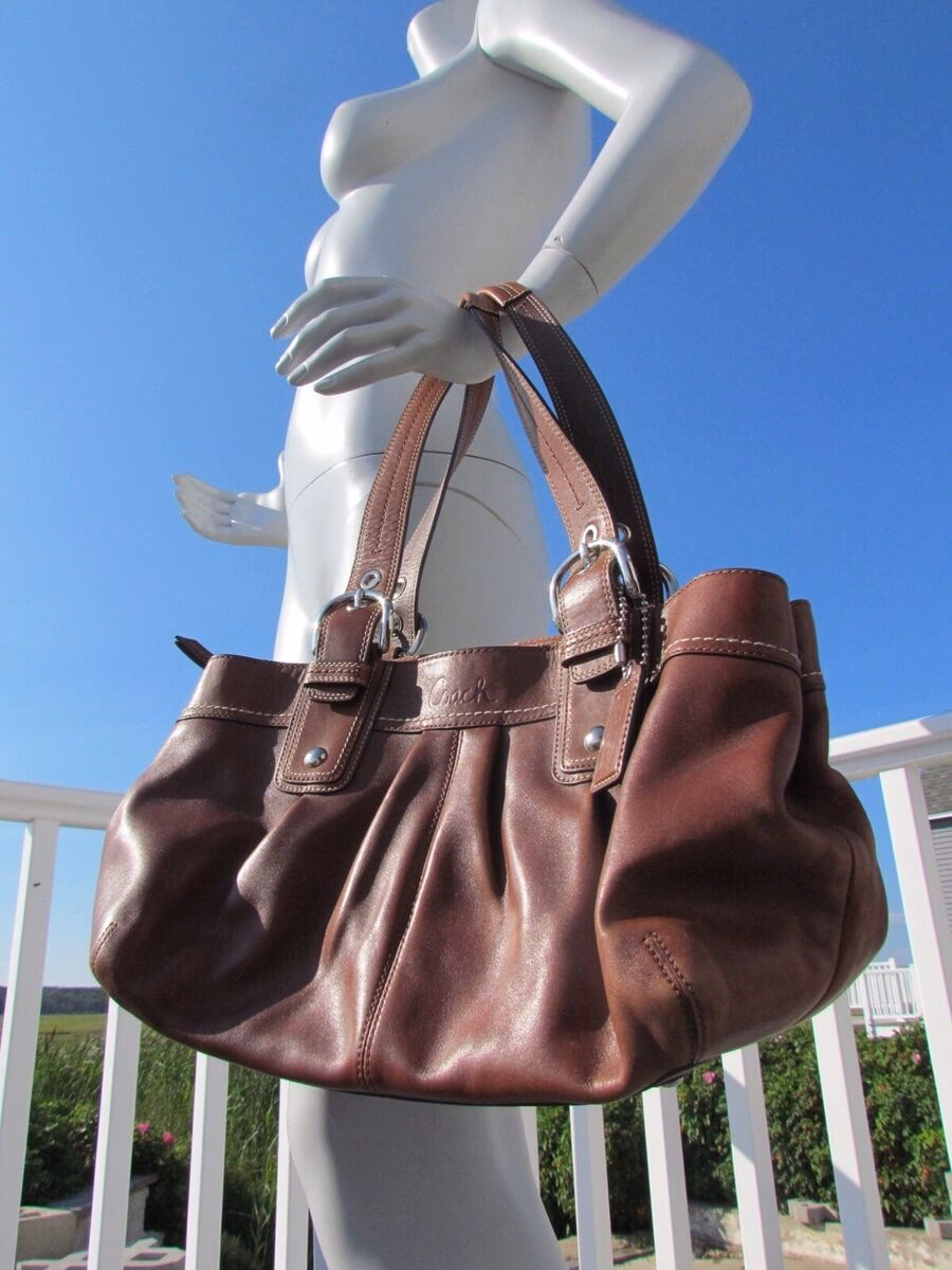 What is the color of the Coach tote bag for sale?