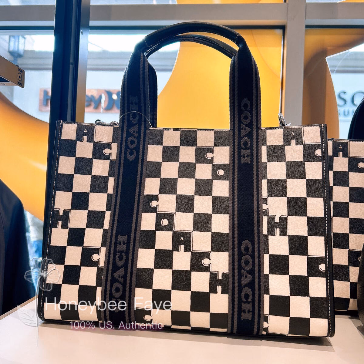 What can a pebble leather tote carry?