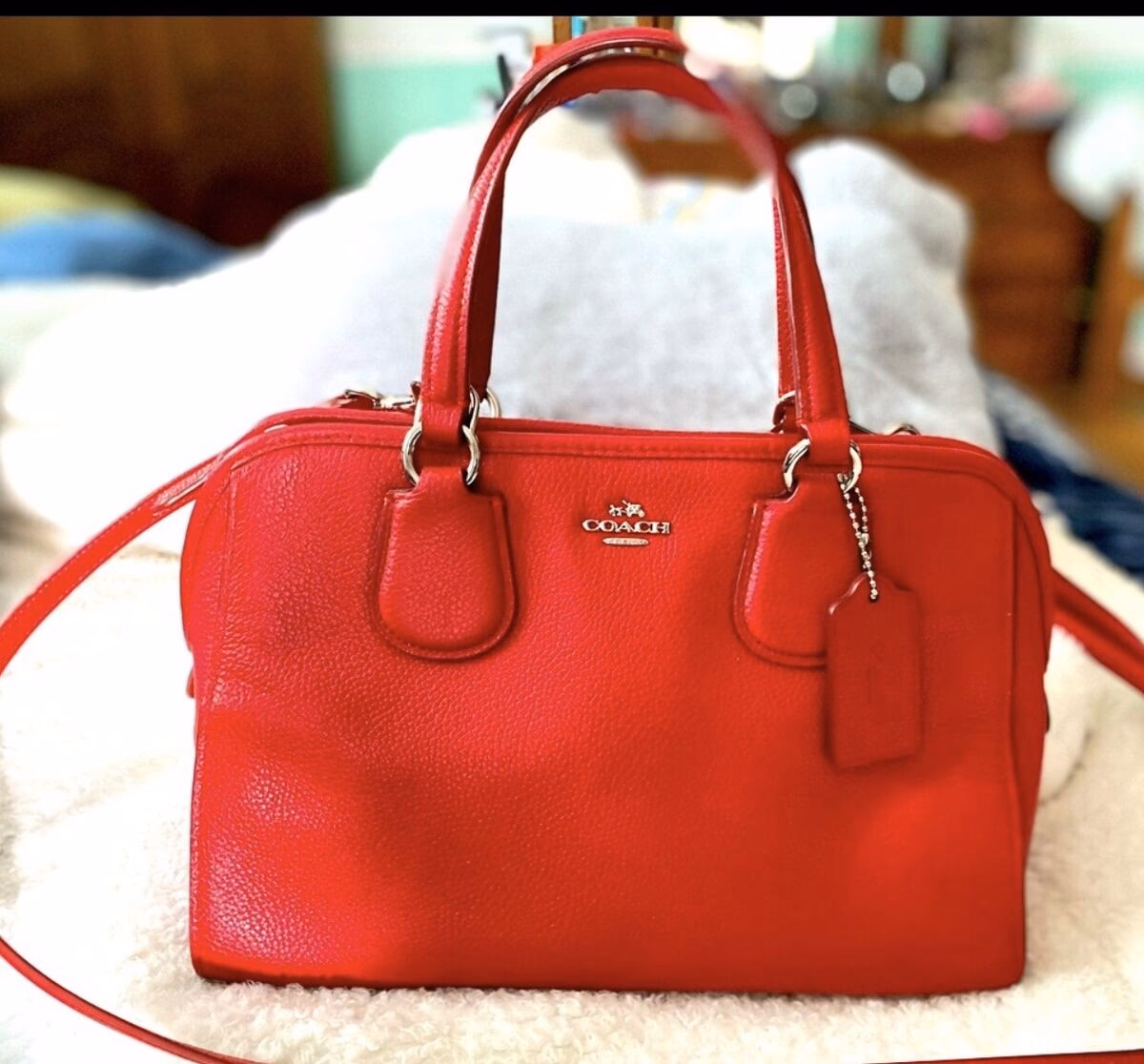 Why should you buy a red Coach bag?