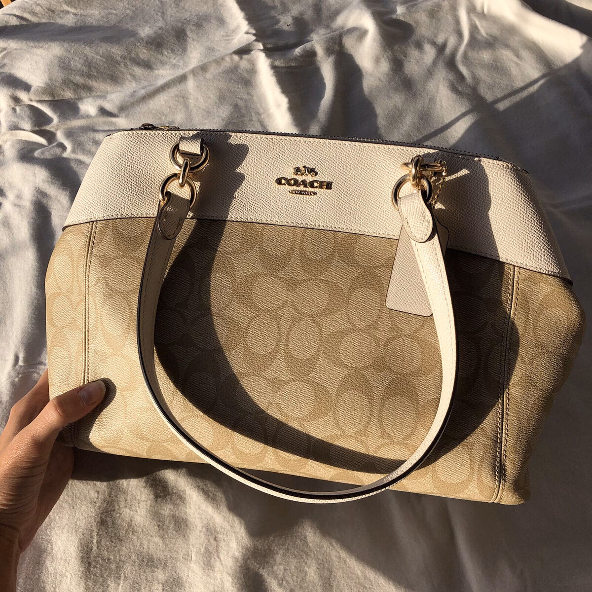 What is the name of the Coach purse with C's?