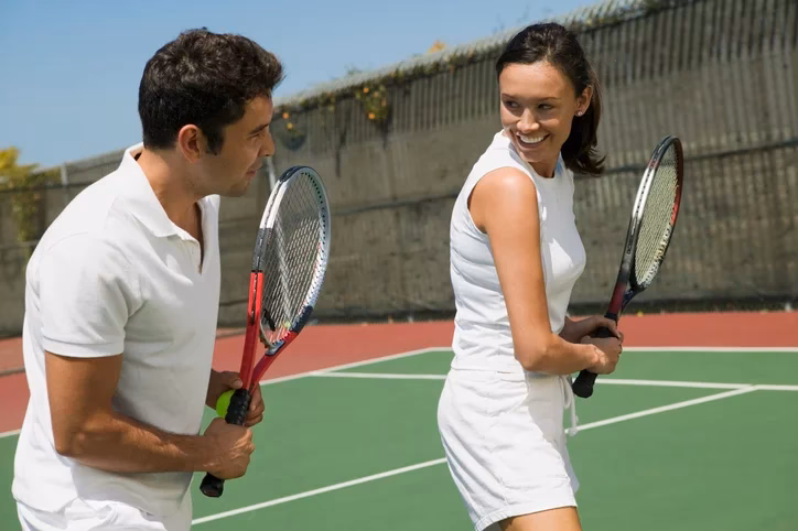 What does a full time tennis coach do?