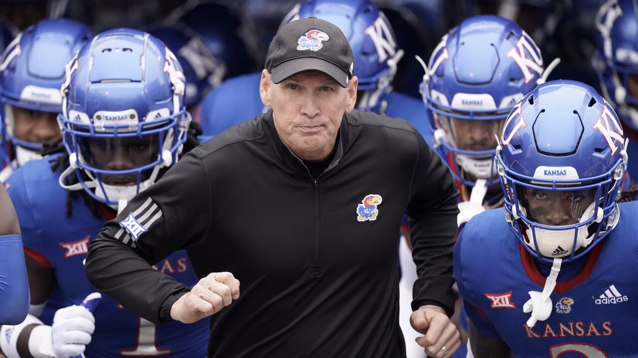 Who is the head coach of the Kansas Jayhawks?