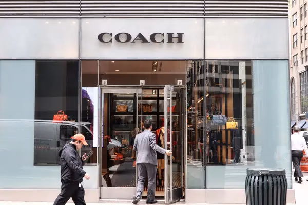 Does coach own Michael Kors?