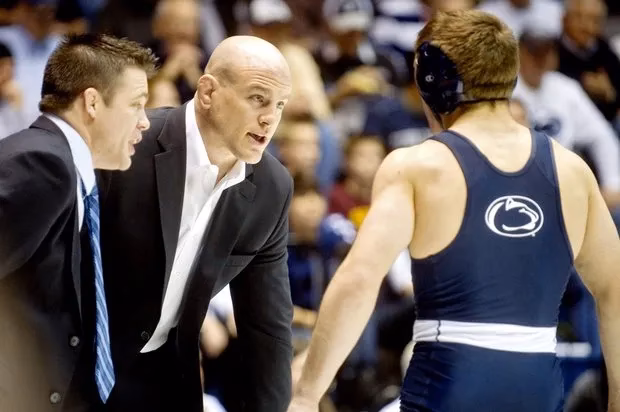 What does a wrestling coach do?